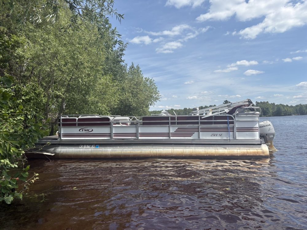 Phillips Pontoon Co.'s 25-foot TMC pontoon on a Northwoods lake