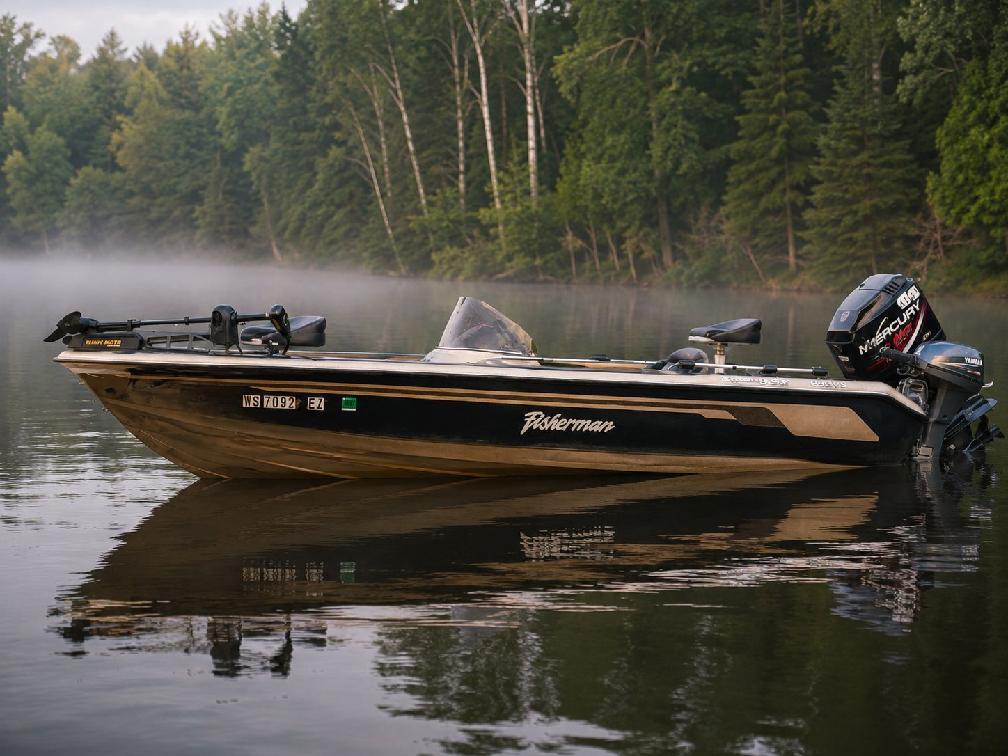 Phillips Pontoon Co.'s 1998 Ranger 692 Fisherman at rest on a misty Northwoods lake at dawn
